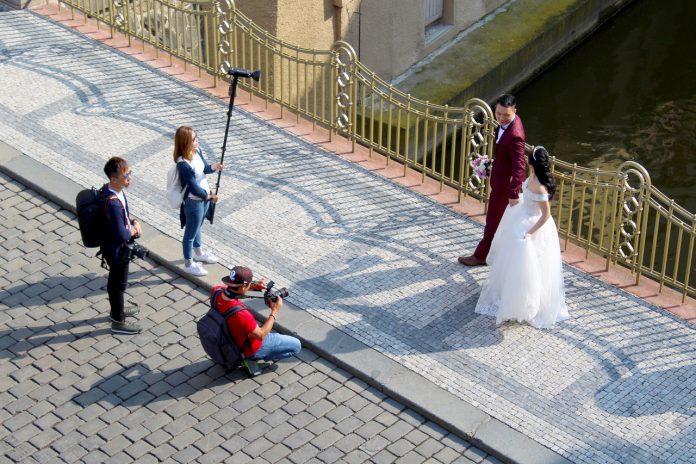 Sydney wedding photographer and his team taking prenup photos with the couple.